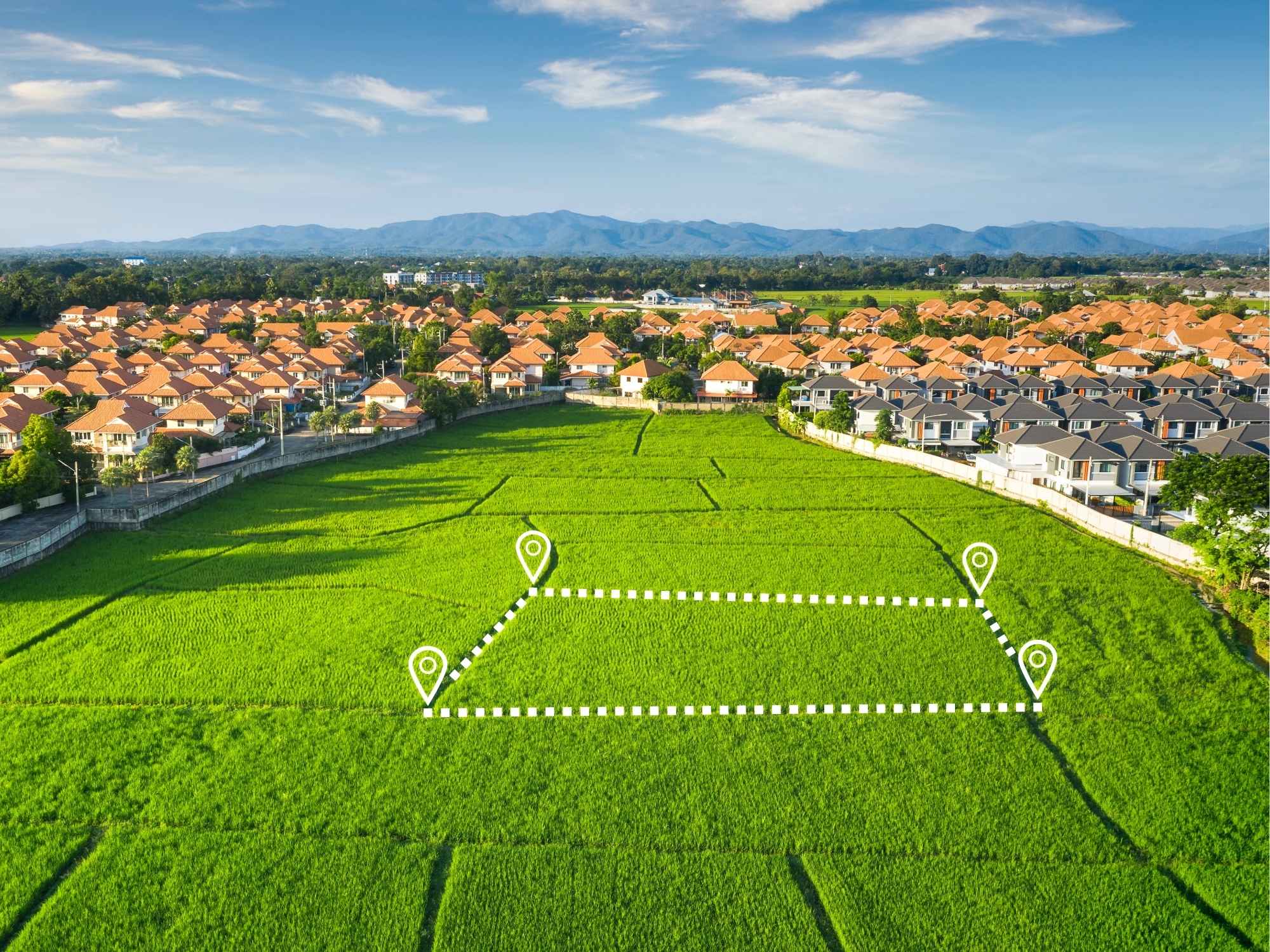 Aerial view of a plot outlined between two residential neighbourhoods, with no road frontage of its own